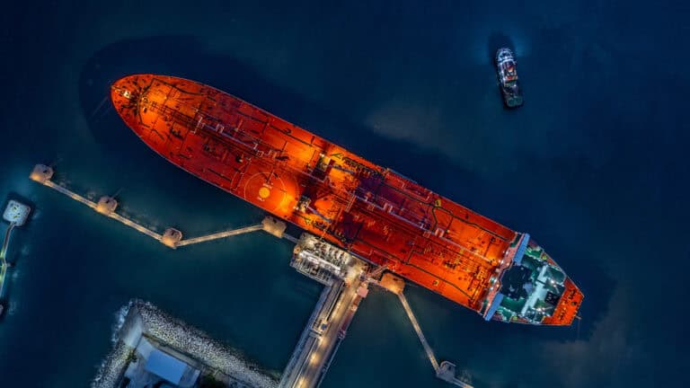 aerial top view industrial crude oil fuel tanker ship at termina